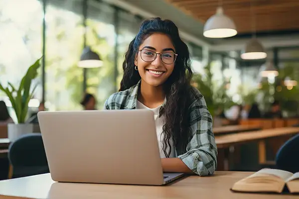 Focused teenage girl studying diligently at home in Thousand Oaks, CA, demonstrating improved academic motivation and concentration skills developed through effective teen therapy